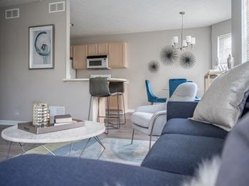 View from living area of great room towards dining and kitchen area with breakfast bar